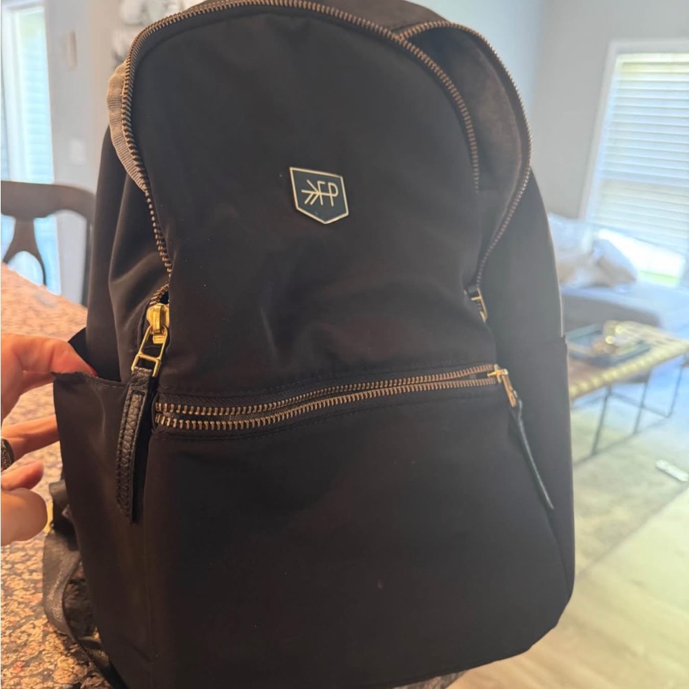 Freshly Picked Black diaper Backpack with Gold Accents.